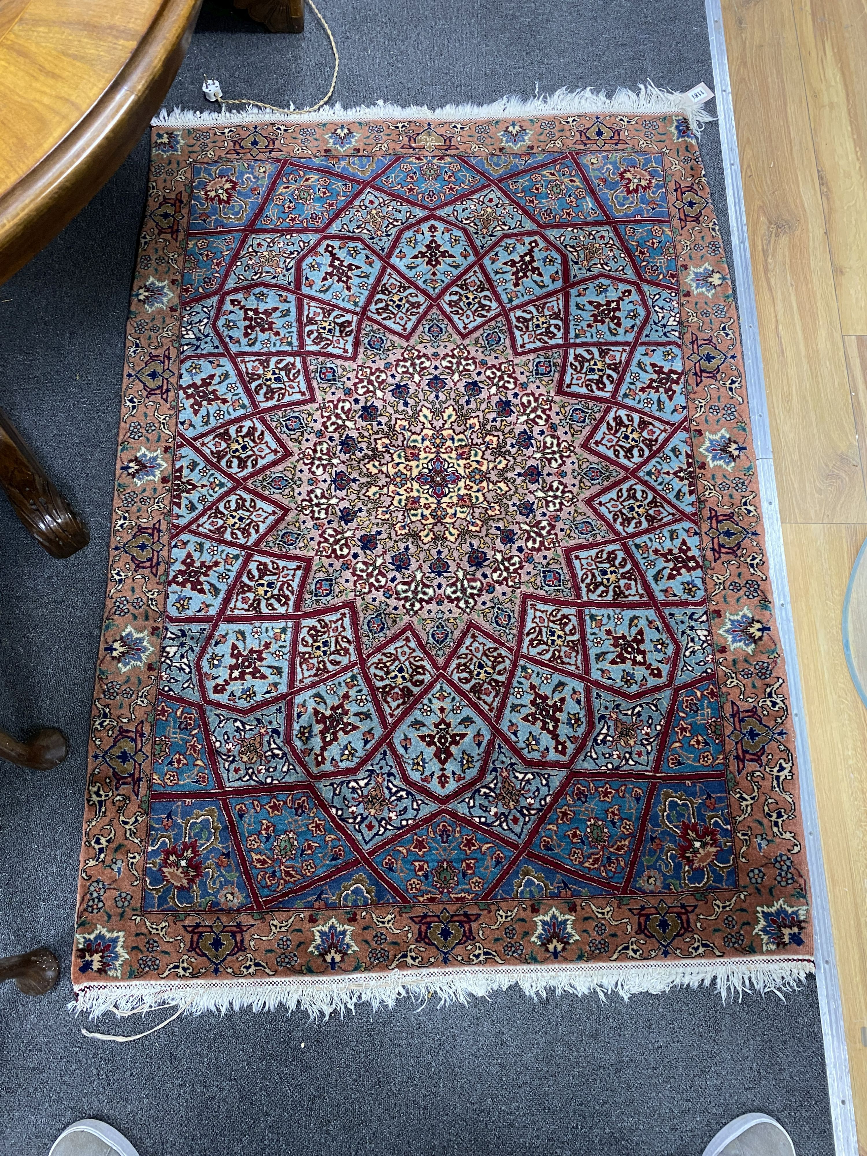 A North West Persian peach ground rug, 140 x 100cm